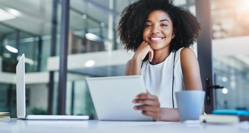 Cropped shot of a smiling young businesswoman working in her office.
