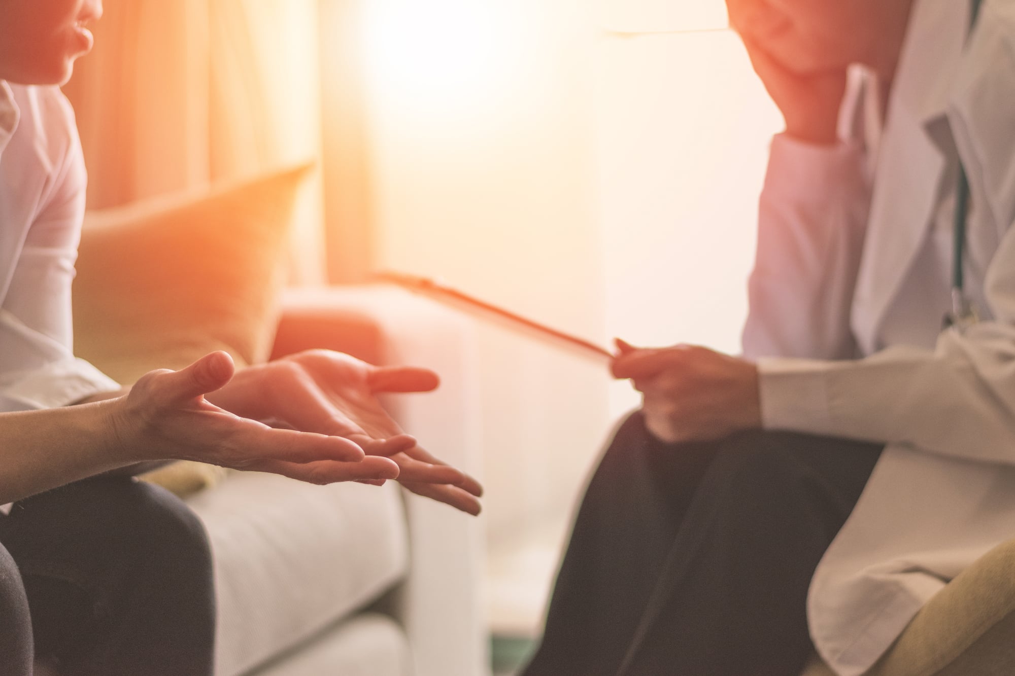 A patient talks with a therapist.