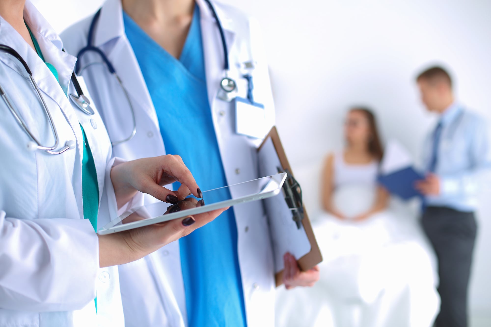 An image depicting medical professionals conversing is shown.