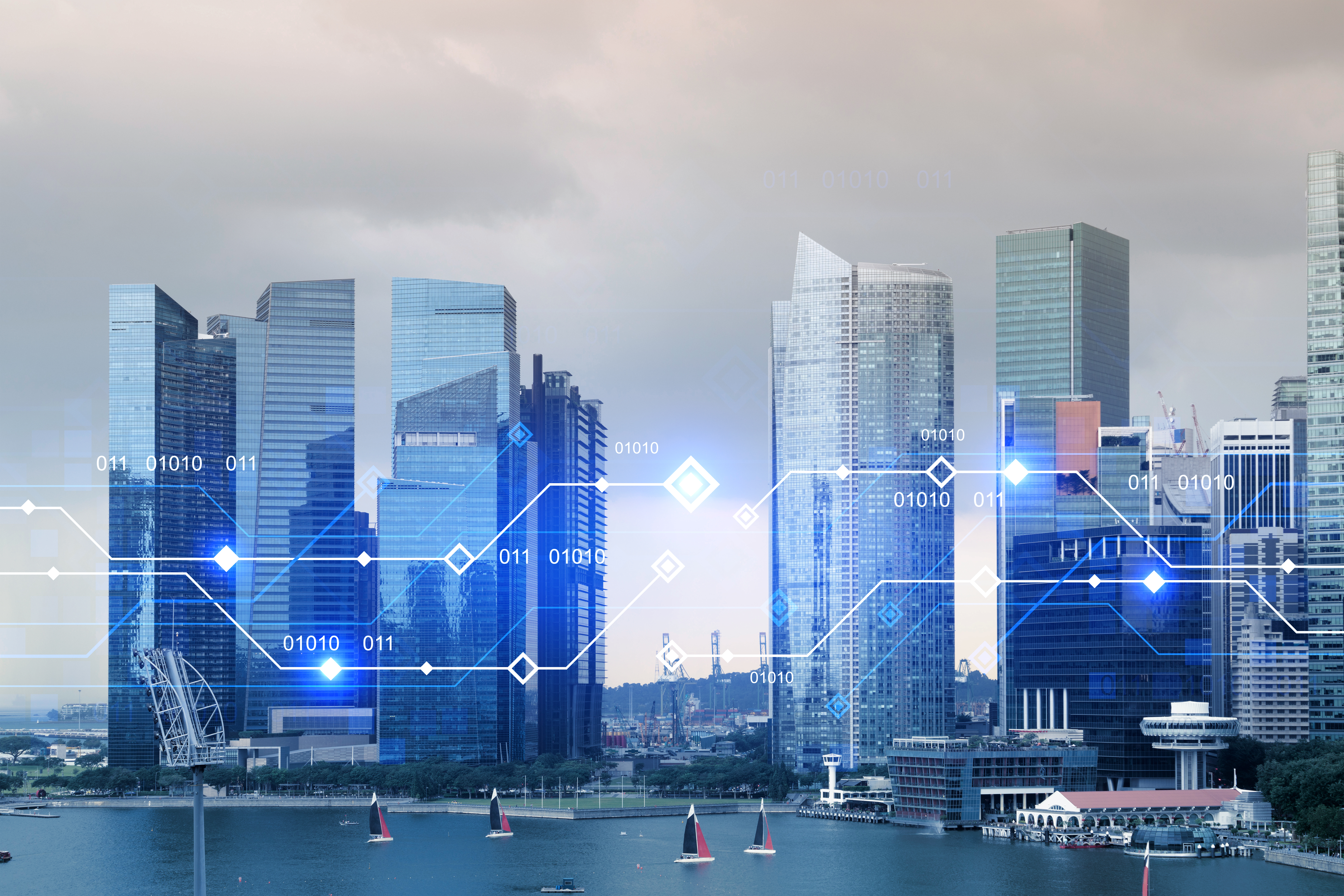 Skyline of modern skyscrapers with a digital overlay.