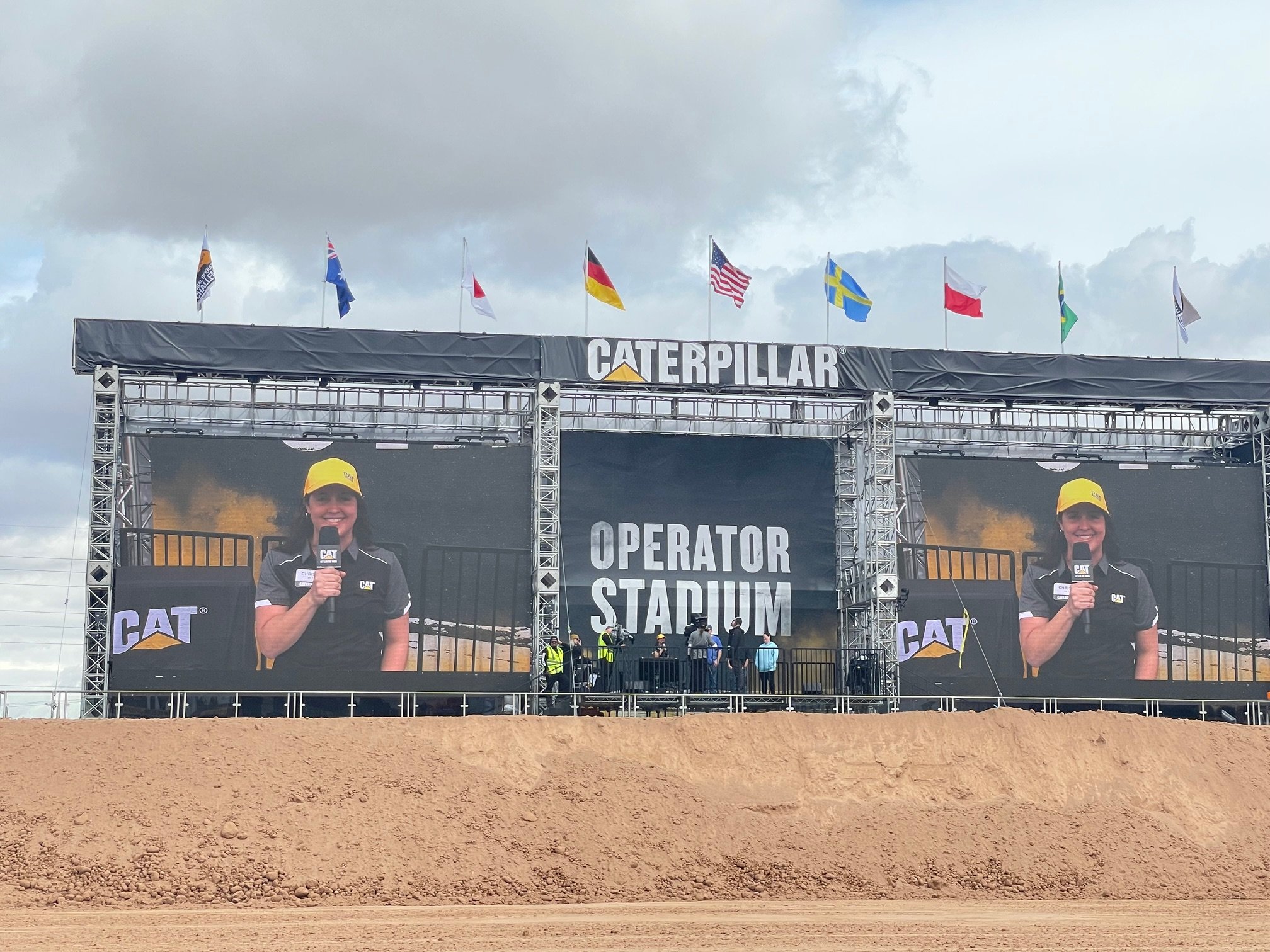 Image of a Caterpillar employee showcased on a big screen at the ConExpo in 2023