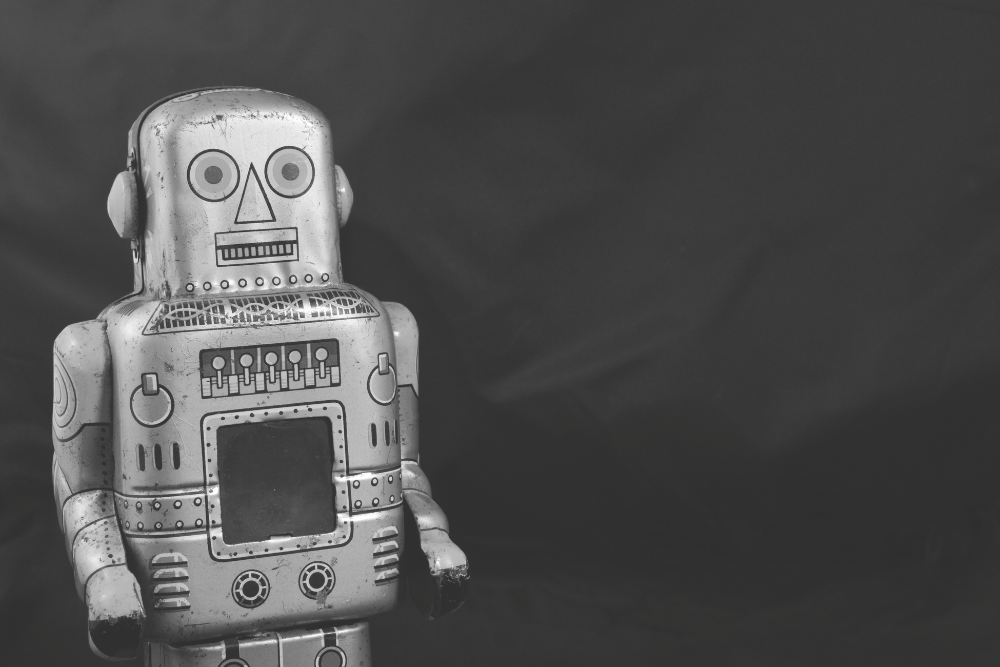 black and white image of a vintage robot figure