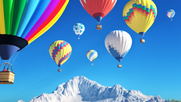 Hot air balloons in a blue sky