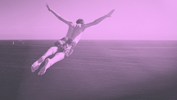 A purple-toned image of a man diving into the ocean. hybrid-creative-business-model