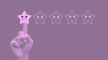 A purple-toned image of an array of five stars with frowning, ambivalent, and smiling faces drawn on them. A finger is pointing to the star on the left with the frowning face, highlighting it to signify one out of five stars in a review. 12-donts-negative-review