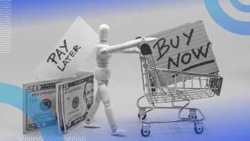 A mannequin pushes a mini shopping cart with a sign saying “buy now” in it. Behind it, dollar bills are labeled “pay later.” /fintech/bnpl-buy-now-pay-later-regulations
