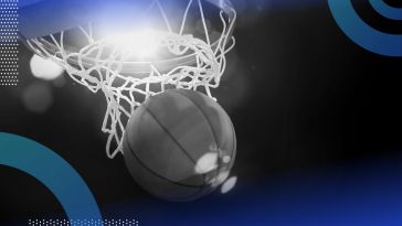 A basketball falls through the hoop