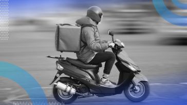 A person rides a scooter, delivering food. /mobile-technology/apps-for-gig-drivers