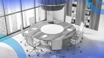 A 3D mockup of an office featuring a round office table surrounded by empty chairs and a city skyline outside the windows. /company-culture/redesign-office-for-collaboration