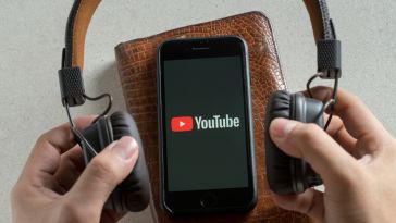 The YouTube app between over-ear headphones