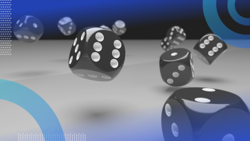 A group of dice rolling across a table.