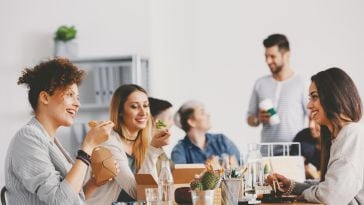 Coworkers take a lunch break.