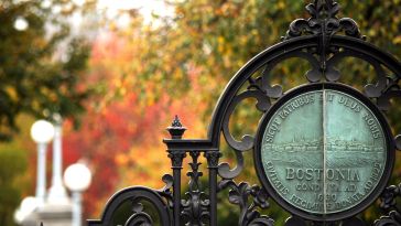 The entrance gate to Boston Public Garden with the official seal of Boston