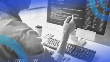Source Code person looking at code on monitor
