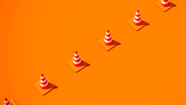 A line of cones setting up a work boundary.