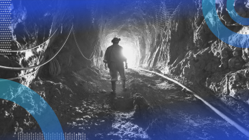Data mining image of a miner walking down a shaft toward daylight