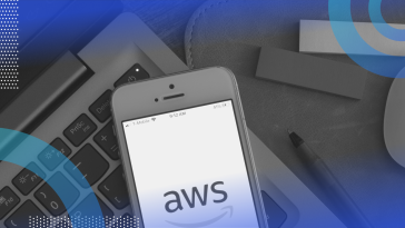 Amazon Web Services (AWS) image of a smartphone with an AWS logo on it, sitting on top of a laptop.