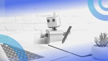A robot at a desk. Intelligent automation trends for 2023 include more human-digital collaboration. 