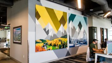 Locally-inspired art featuring stylized mountains against a chevron background in Choozle's Denver office