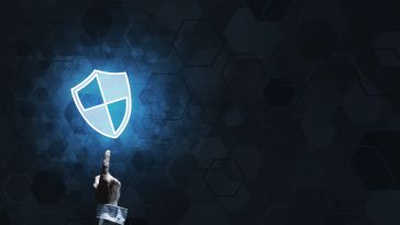 hand pointing up toward cybersecurity shield icon