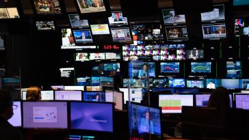 A photo of the media room at NBCUniversal, featuring hundreds of screens