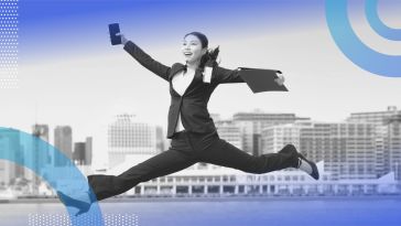 A woman jumping in the air. Bounce back from being fired by taking care of yourself and not rushing into another job.