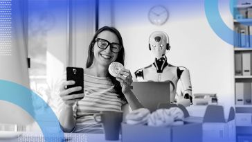 An employee eating donuts while a robot works at the desk behind her.