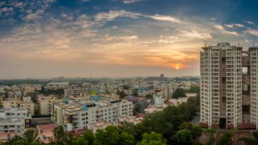 A photograph of Bangalore, India's cityscape at dusk