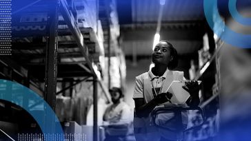 A warehouse worker carrying a clipboard.