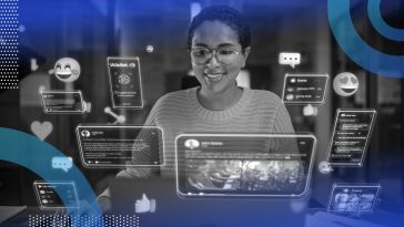 A smiling woman engaging with holographic representation of IoT.