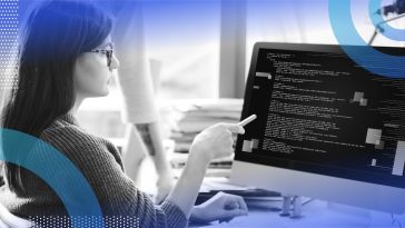 Developer writing HTML code on computer