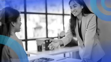 Employer interviewing a job candidate and shaking hands