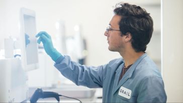 GRAIL scientist reviewing results on a computer in a lab