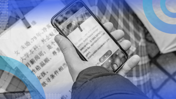 A person is using a mobile app to translate Chinese characters into English.