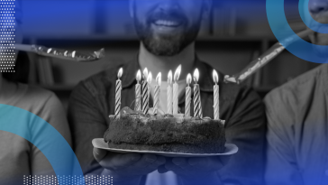 people blowing out birthday candles on a cake