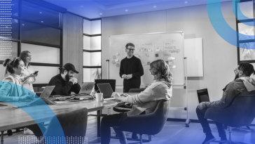 Engineering team collaborating in board room