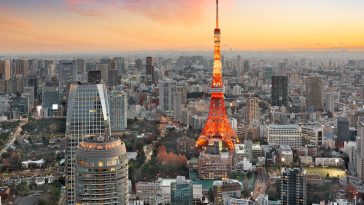 Tokyo at sunrise with a focus on the Red Tokyo Tower. 