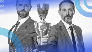 Two businessmen hold a trophy