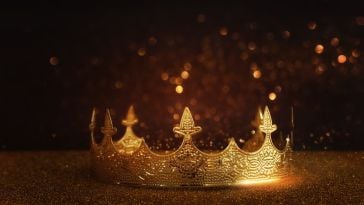 Gold crown layered over black background.