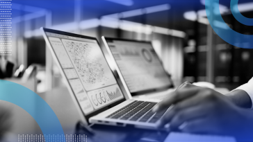 A closeup of a person's hands working on a laptop showing business intelligence tools