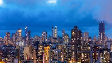 A skyline view of Mumbai at night.