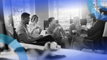 A group of young professionals drink coffee together