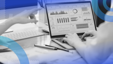 Two marketers reviewing a platform with data