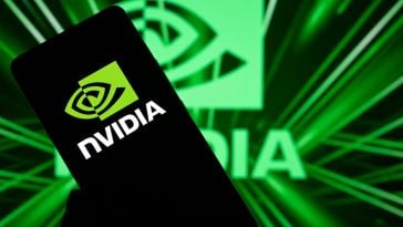 A photo of a smartphone with the Nvidia logo on it, against a backdrop with the Nvidia logo.