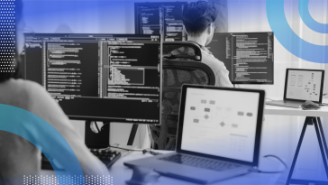 Two developers coding in javascript on computers