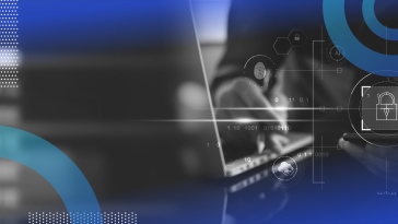 A user works at a laptop with a lock icon