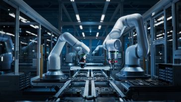 A group of autonomous robot arms working on an assembly line.