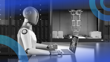 A robot works on a laptop