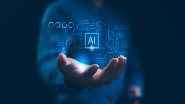 An illustration featuring the letters AI hovers over a person's open palm.
