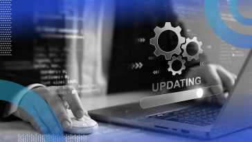 A user works on a laptop that is updating